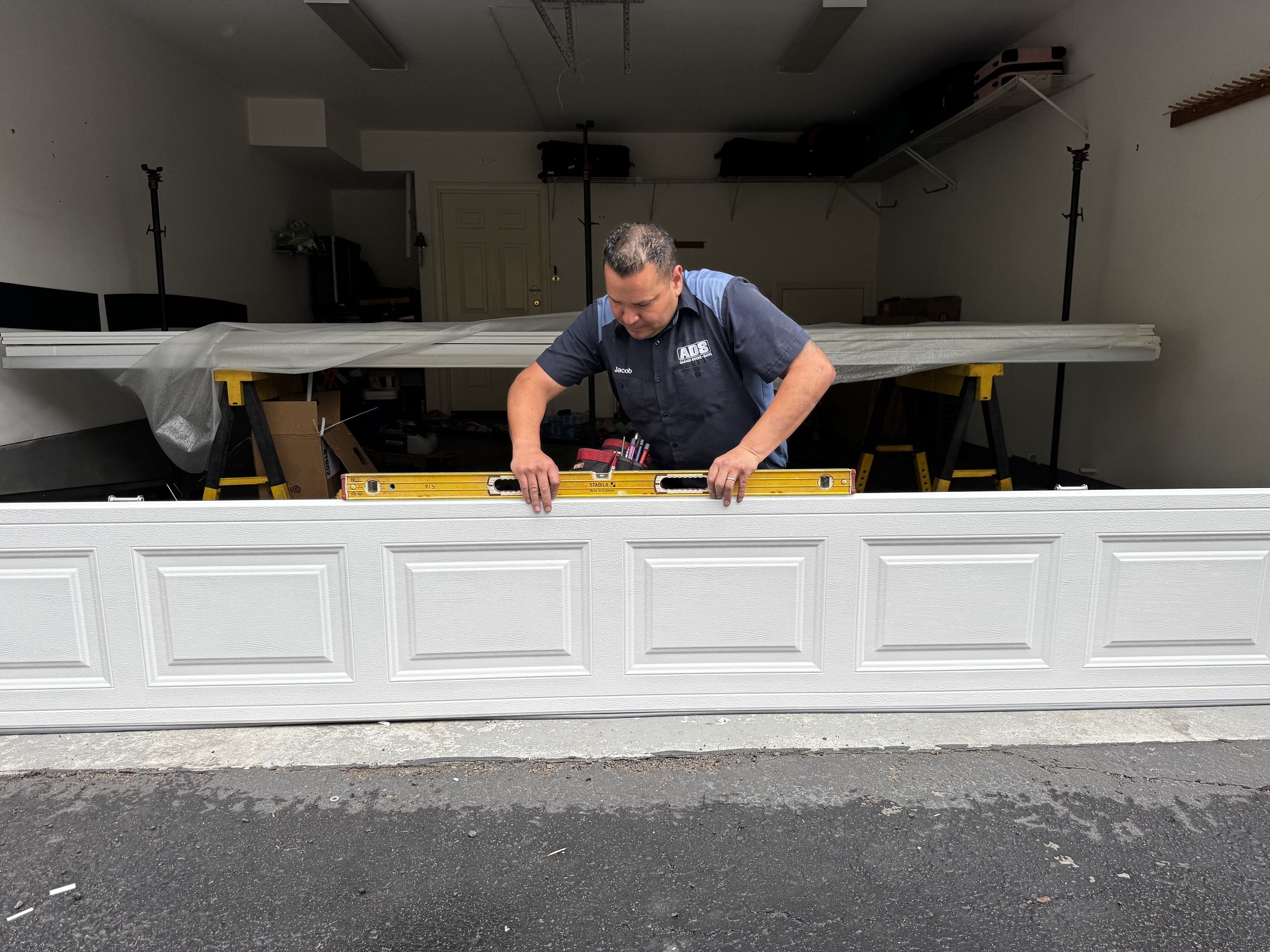 person trying to install garage door 