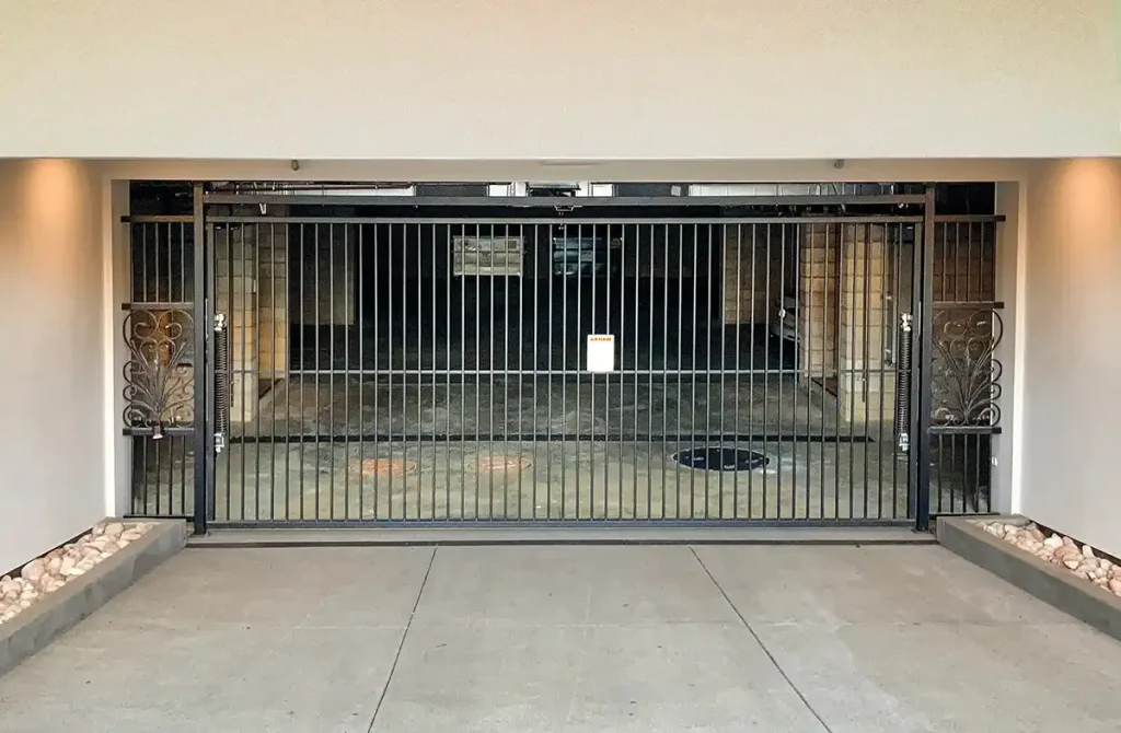 Metal gate closing off parking area