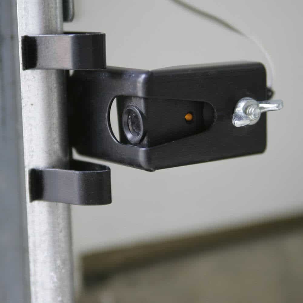 Garage door sensor mounted on frame